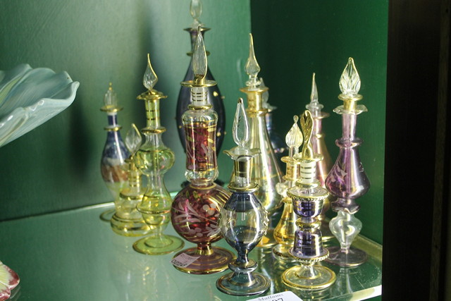 Appraisal: A COLLECTION OF THIRTEEN COLOURED GLASS VENETIAN STYLE SCENT BOTTLES