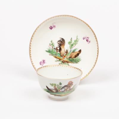 Appraisal: A Hague tea bowl and saucer circa decorated hens and