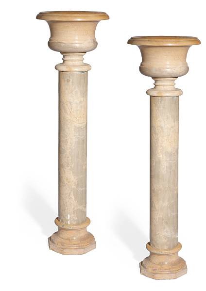 Appraisal: A pair of Baroque style variegated marble pedestal urns Each