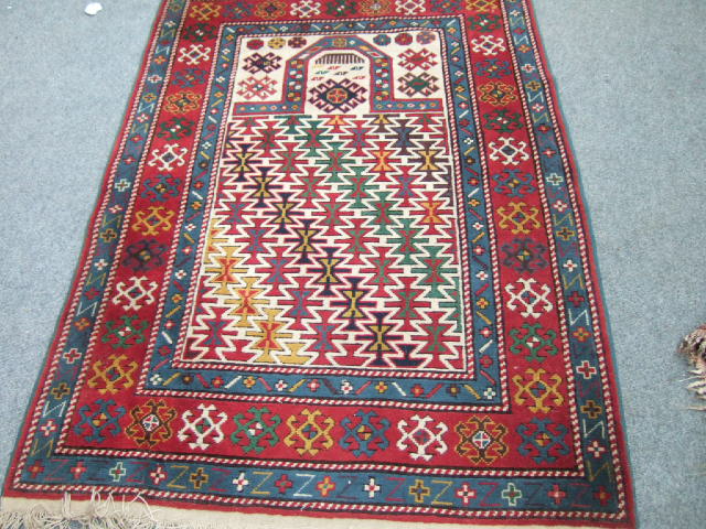 Appraisal: A Turkish rug of Kazakh prayer rug design the ivory