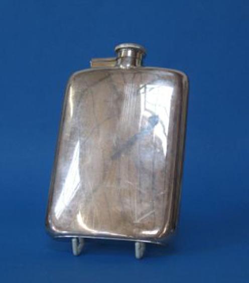 Appraisal: A HIP FLASK of rectangular form with a bayonet fitted