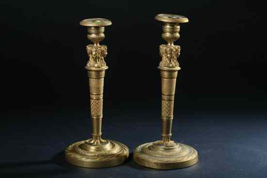 Appraisal: PAIR EMPIRE ORMOLU CANDLESTICKS Circa Circular foot columnar standard surmounted