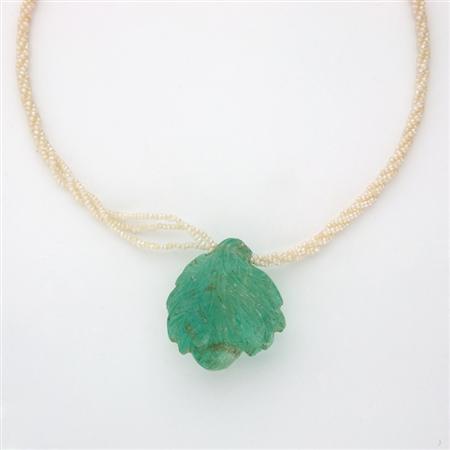 Appraisal: Triple Strand Twisted Seed Pearl Necklace with Carved Emerald Pendant