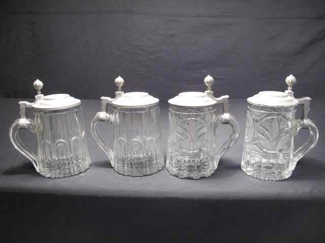 Appraisal: Four cut crystal pewter steins Condition tarnishing from age minor