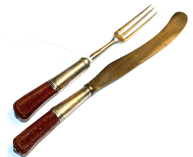 Appraisal: AN ASPREY SILVER THREE PRONG FORK AND KNIFE with steel