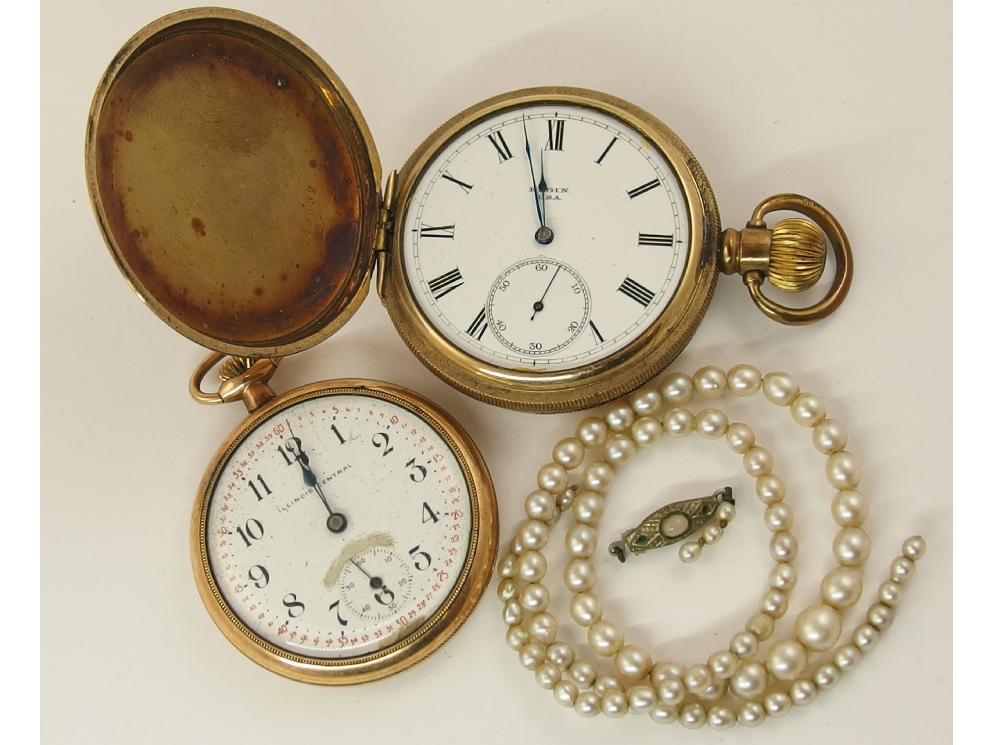 Appraisal: Two gold plated pocket watches and a string of pearls