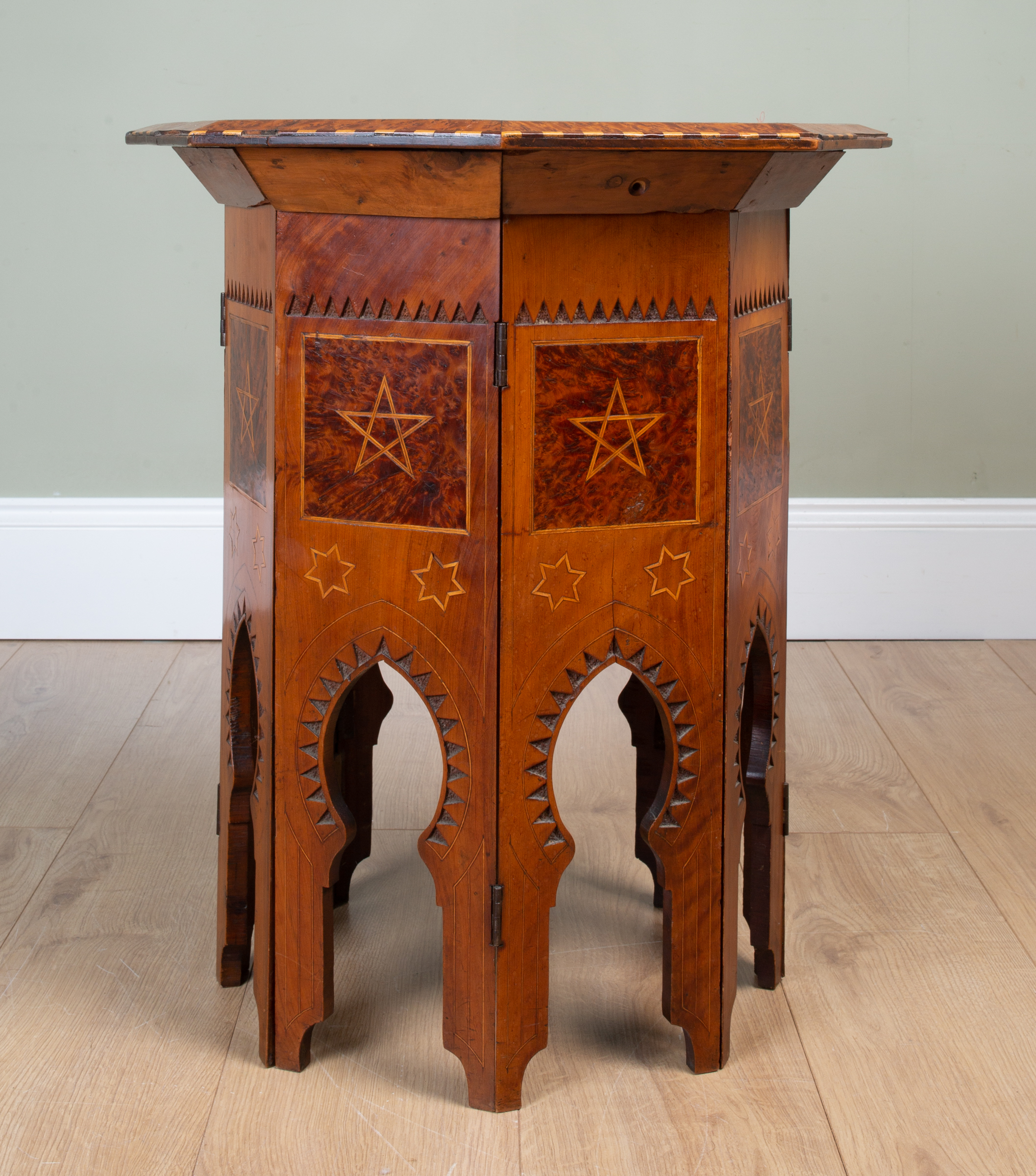 Appraisal: A folding yew wood Middle Eastern octagonal occasional table the