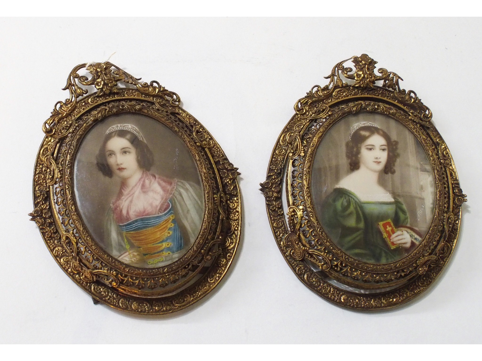 Appraisal: A pair of portrait miniatures in gilt metal frames