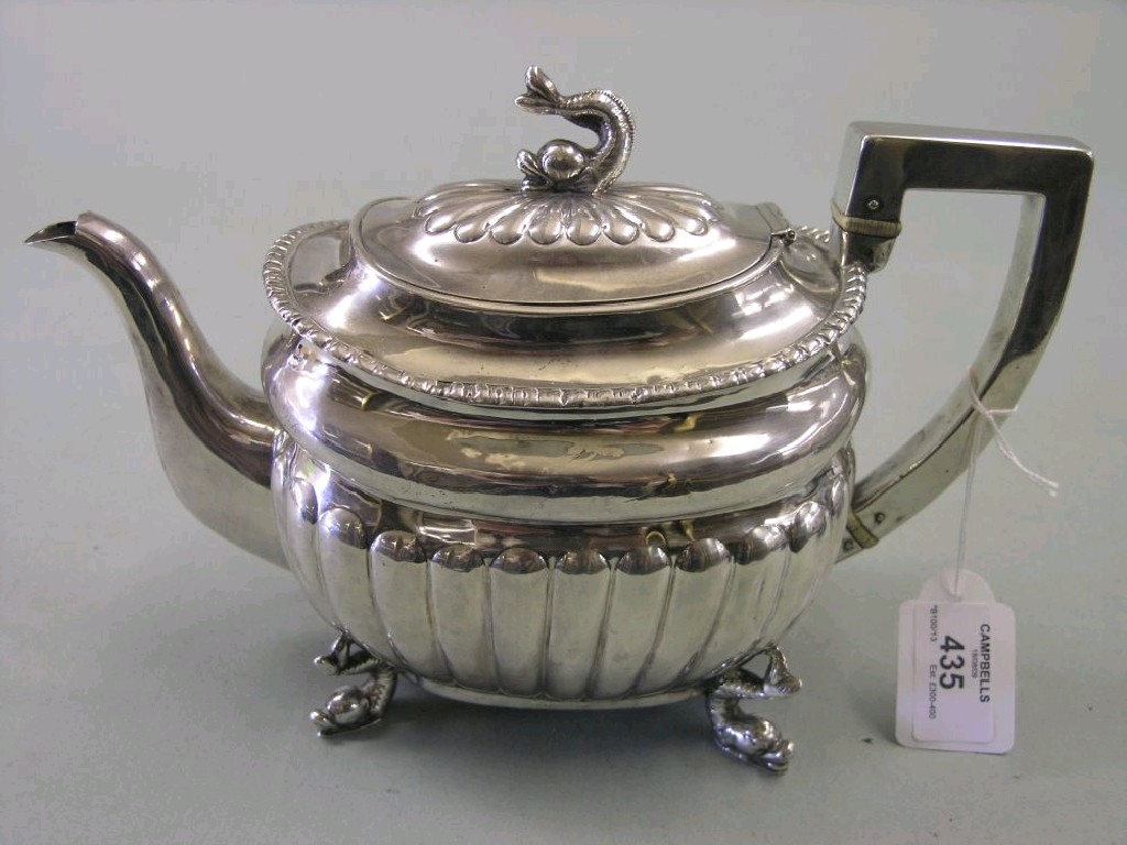 Appraisal: A George III silver teapot oval half-reeded form hinged cover