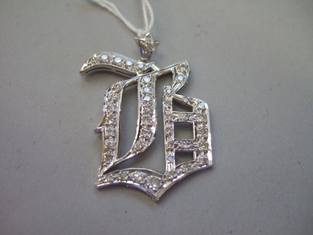 Appraisal: A diamond set pendant designed as a Gothic initial B