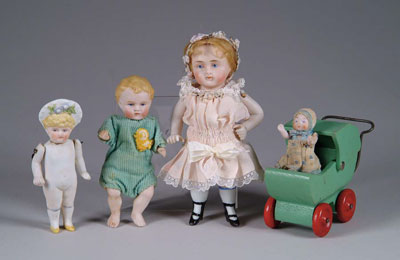 Appraisal: BISQUE DOLLS AND WOOD BABY COACH stiff neck all-bisque with