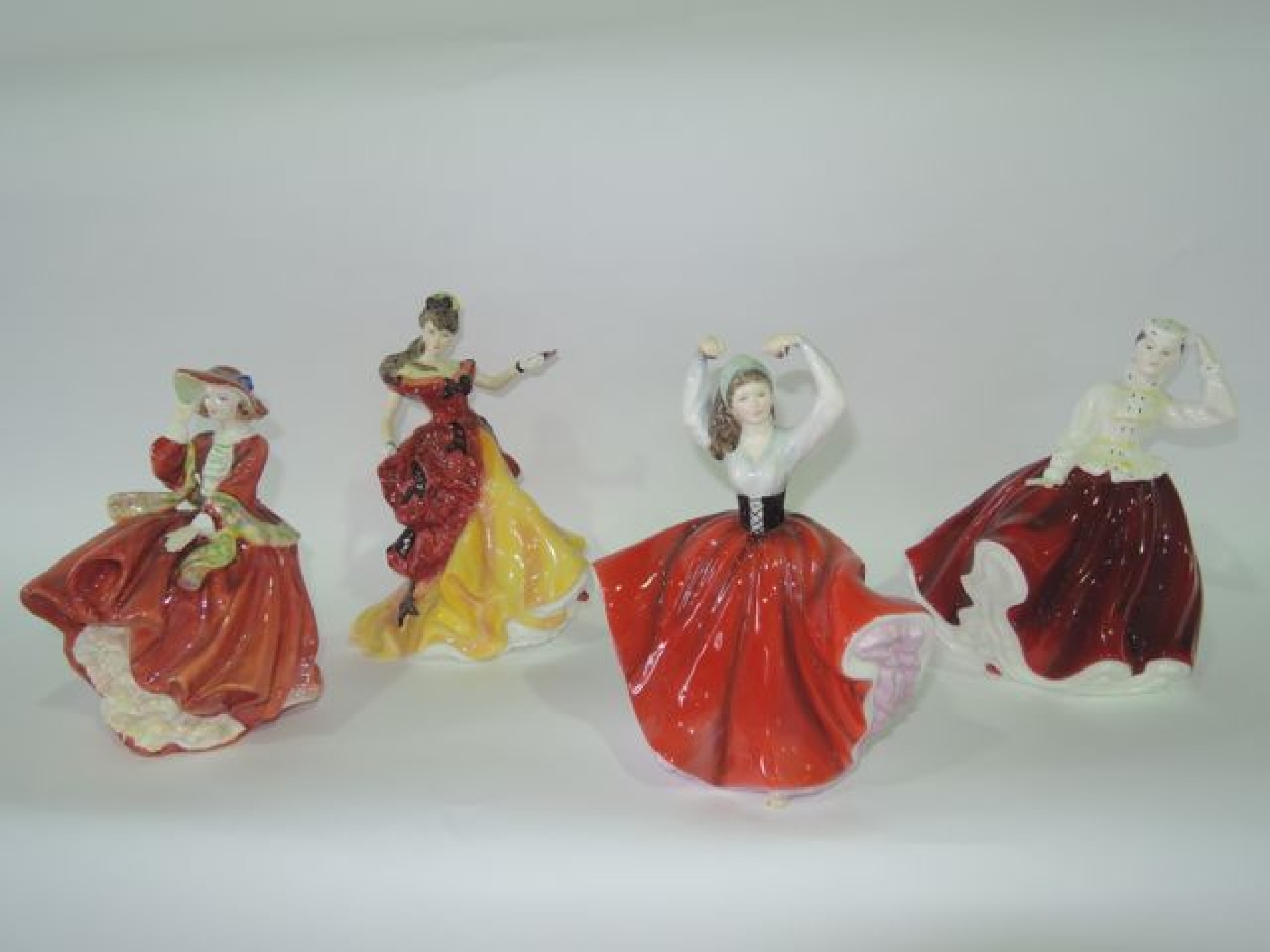 Appraisal: A collection of four Royal Doulton figures comprising Karen HN