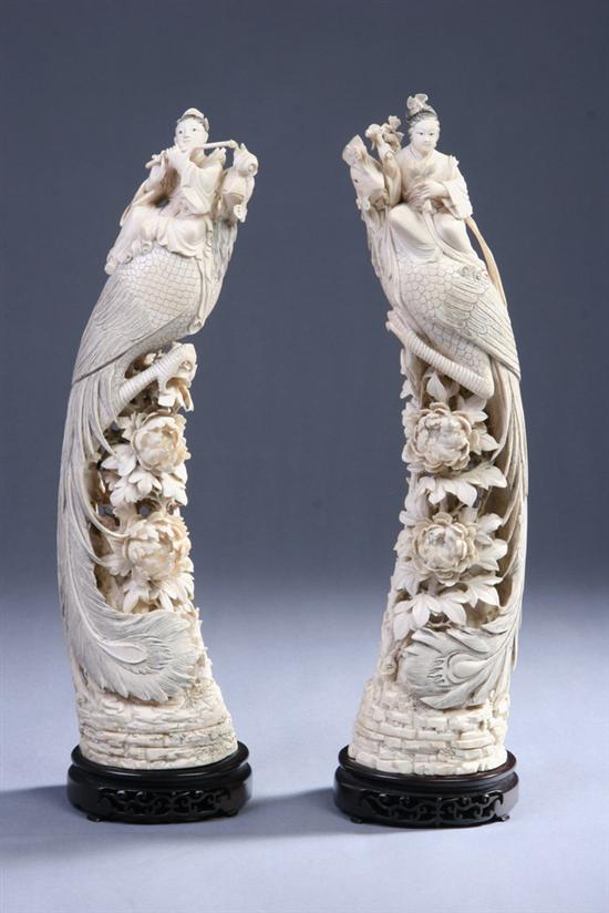 Appraisal: PAIR CHINESE CARVED IVORY FIGURES OF PHOENIX BIRDS - in