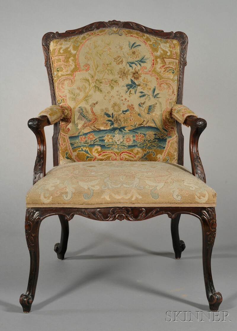 Appraisal: Louis XV-style Walnut Fauteuil th century the frame carved with