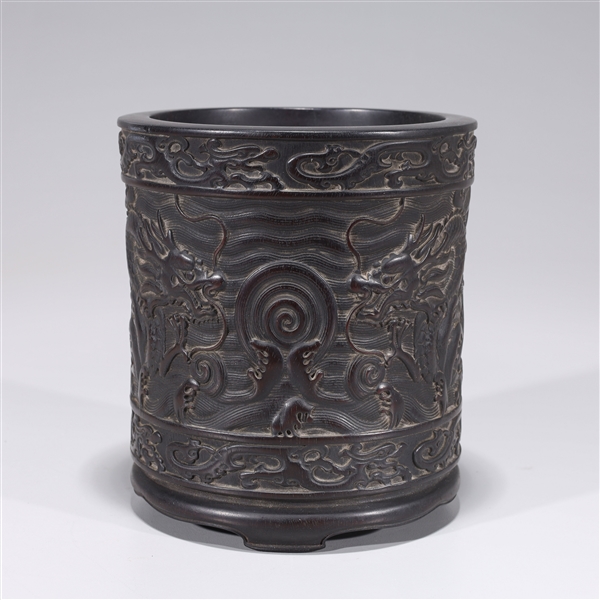 Appraisal: Chinese carved hardwood brush pot with twin dragons chasing flaming