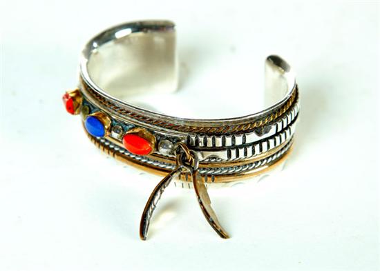 Appraisal: NAVAJO BRACELET BY AJ PLATERO Silver and gold with inset