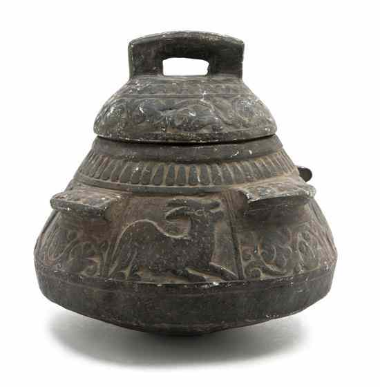 Appraisal: A Middle Eastern Carved Stone Vessel the domed lid having