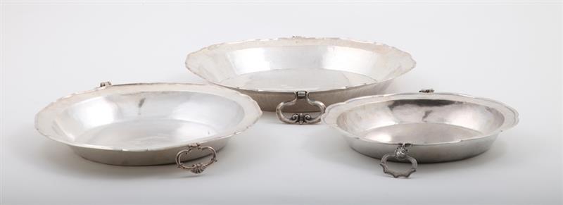 Appraisal: THREE SIMILAR LATIN AMERICAN HAMMERED SILVER BASINS Unmarked with drop