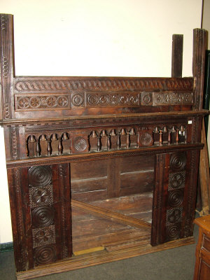 Appraisal: A carved oak Breton cabinet on stand the dentil moulded