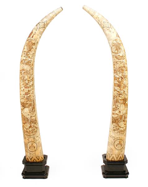 Appraisal: A large pair of carved bone veneer tusks height ft