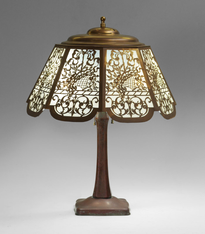 Appraisal: HANDEL BASE FILIGREE SLAG GLASS LAMP Patinated cast metal base