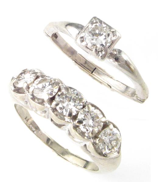 Appraisal: A collection of two diamond and white gold rings featuring