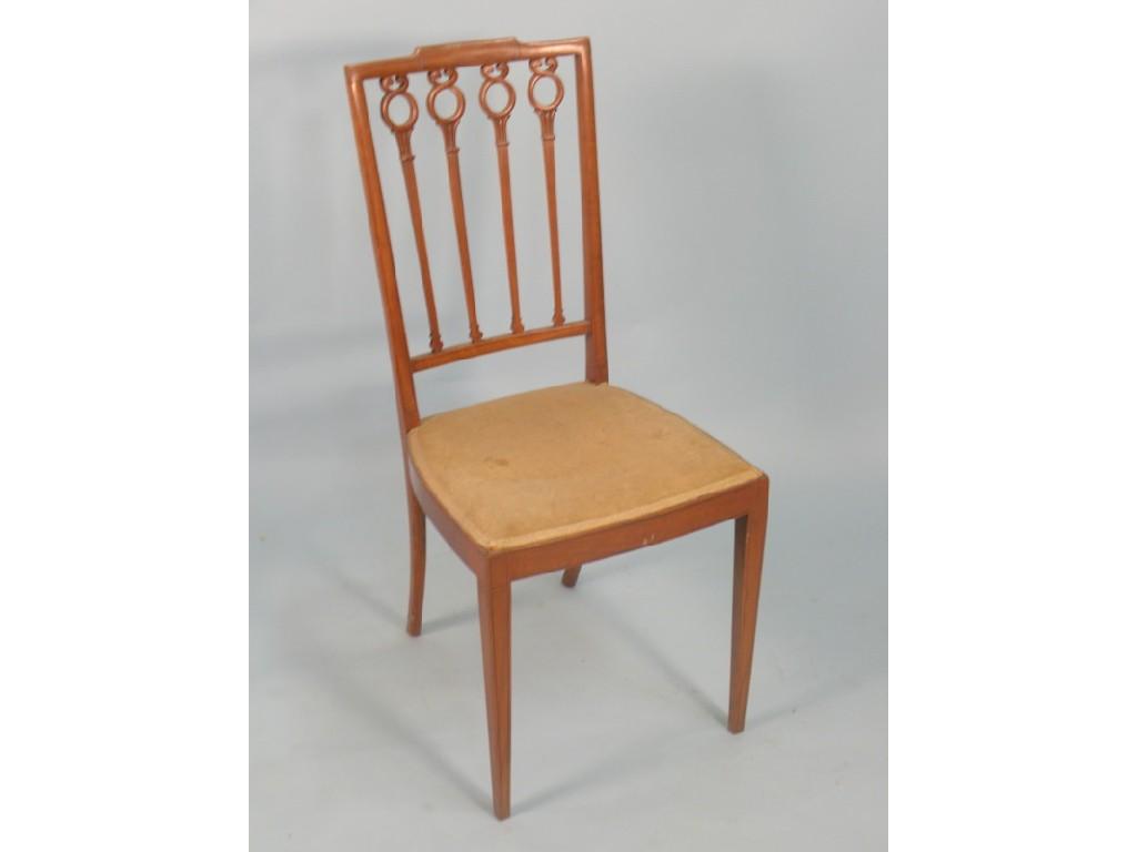 Appraisal: An Edwardian satinwood side chair with a padded seat on