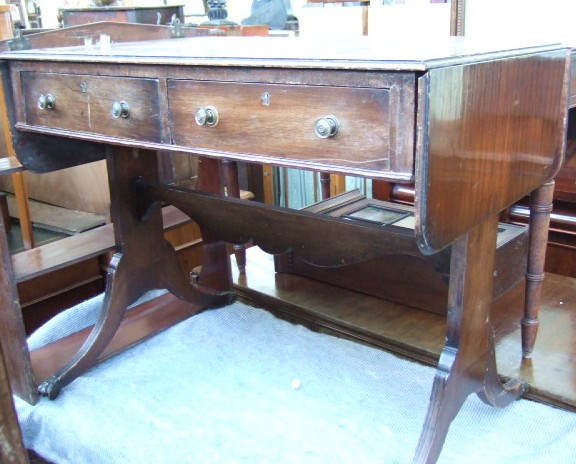 Appraisal: A George III style mahogany sofa table with two drawers