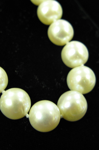 Appraisal: PRINCESS-LENGTH WHITE PEARL NECKLACE strung with round pearls - mm