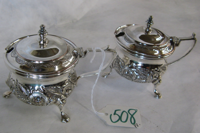 Appraisal: PAIR OF ENGLISH SILVER PLATED CONDIMENT SERVERS having hinged covers