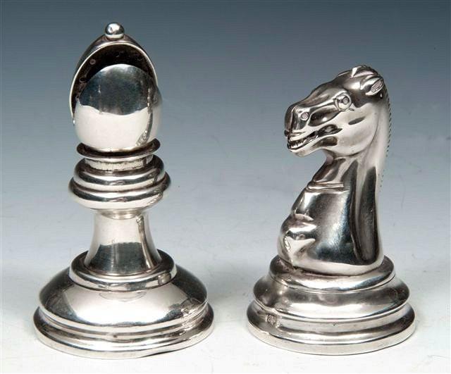 Appraisal: A VICTORIAN SILVER SALT AND PEPPER in the form of