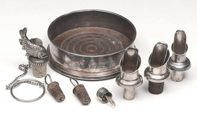 Appraisal: A COLLECTION OF SEVEN SILVER PLATED BOTTLE STOPPERS and a