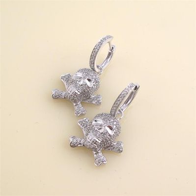 Appraisal: A pair of diamond set white gold skull and cross