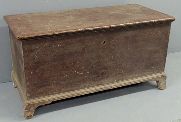 Appraisal: Pennsylvania blanket chest with brown paint decoration French feet and