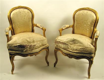 Appraisal: Pair of Louis XV giltwood fauteuils Each with a shaped