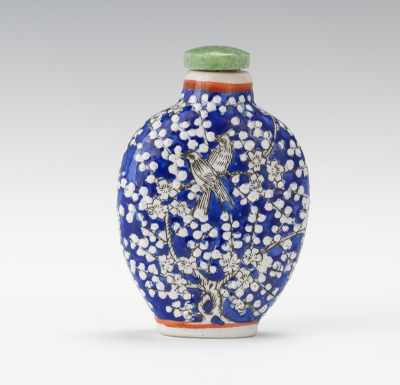 Appraisal: A Blue White Prunus Snuff Bottle in Relief Porcelain bottle