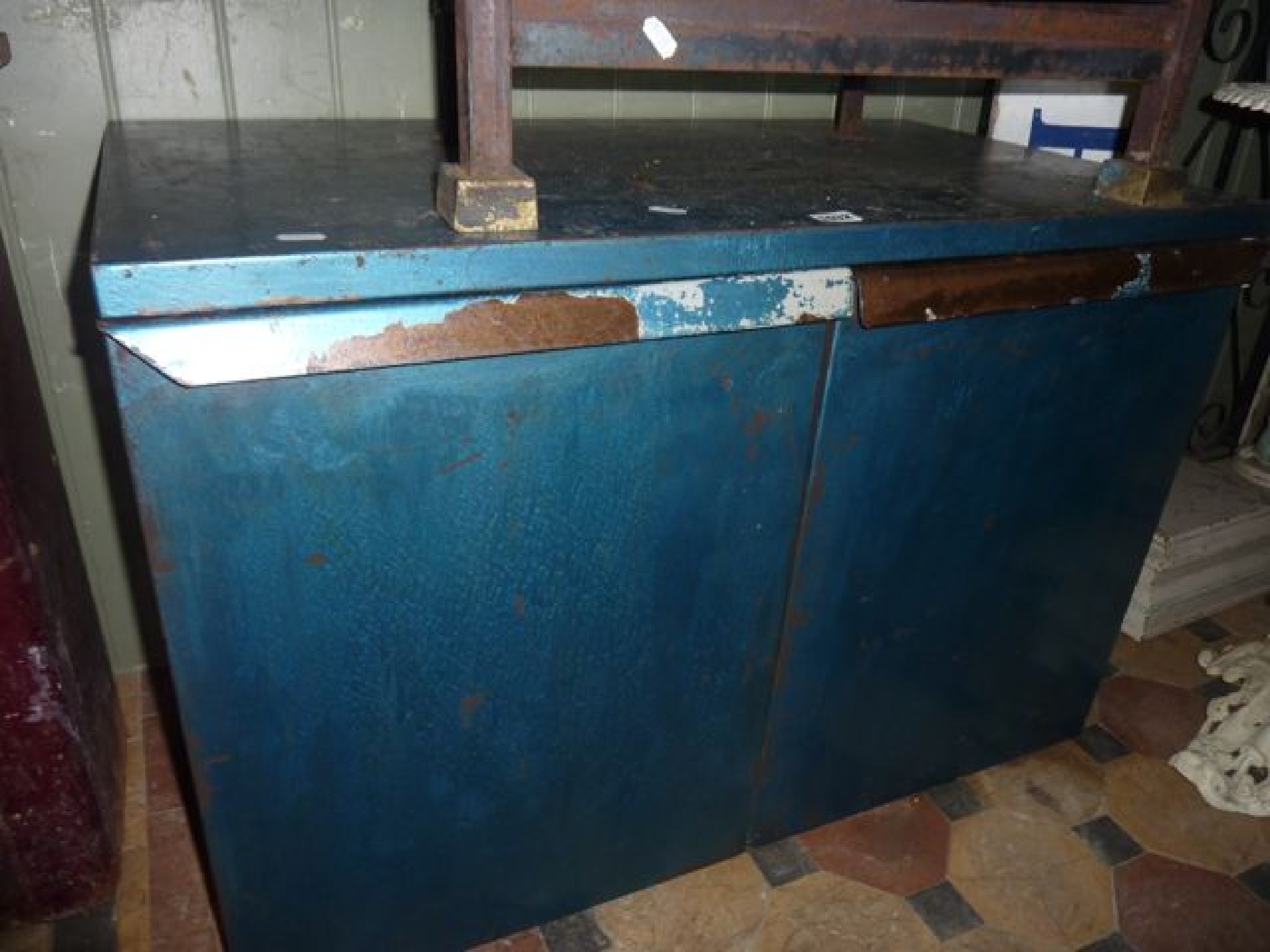 Appraisal: A steel tool cabinet enclosed by two doors with later