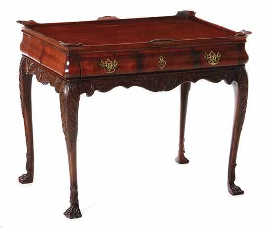 Appraisal: George III style carved mahogany tea table late th century