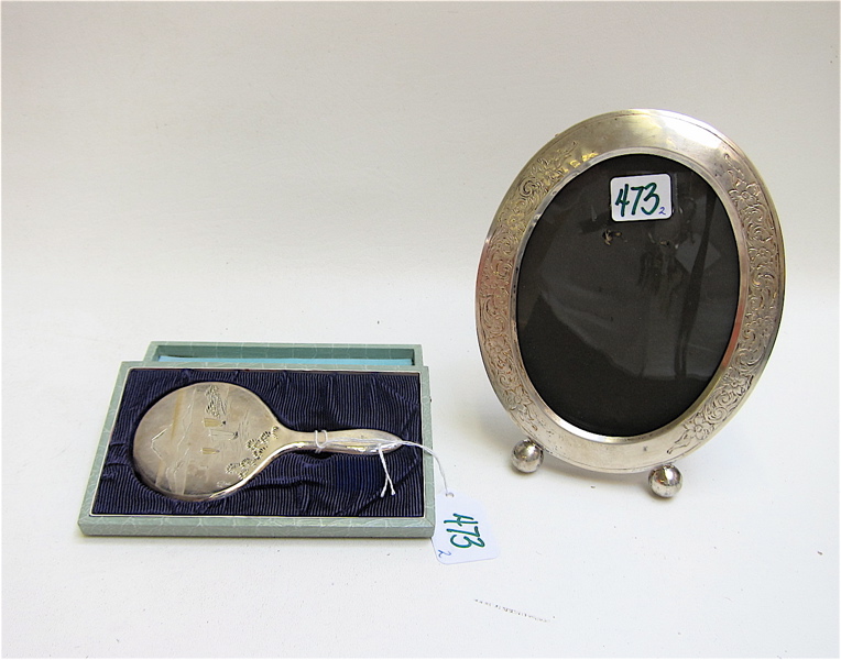 Appraisal: STERLING SILVER PICTURE FRAME AND HAND MIRROR the oval frame