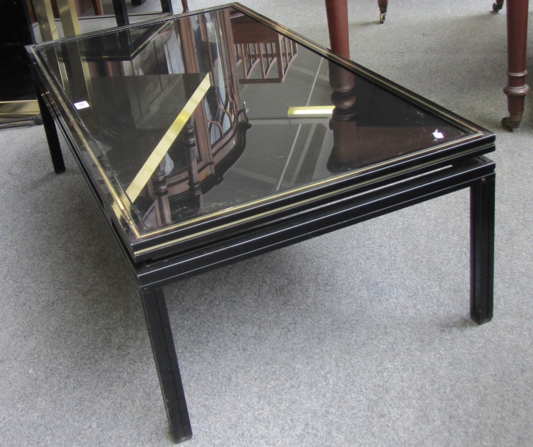 Appraisal: A th century rectangular parcel gilt ebonised coffee table by