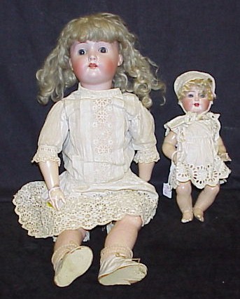 Appraisal: Doll bisque shoulder head AM on cloth body as is