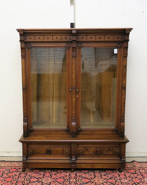 Appraisal: A VICTORIAN WALNUT CABINET BOOKCASE American c the interior divided