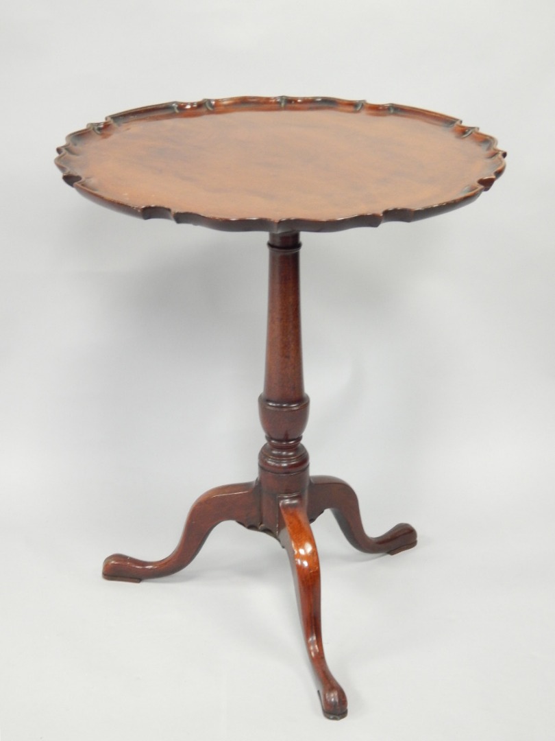 Appraisal: A Victorian mahogany tilt top table having circular top with