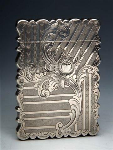 Appraisal: A VICTORIAN SILVER CARD CASE with shaped sides and flower