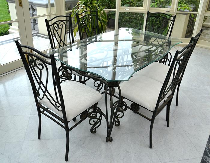 Appraisal: WROUGHT IRON OUTDOOR SETTING AND SIX CHAIRS X X CM