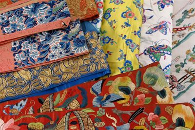 Appraisal: A collection of Chinese embroidered textiles decorated with butterflies flowers