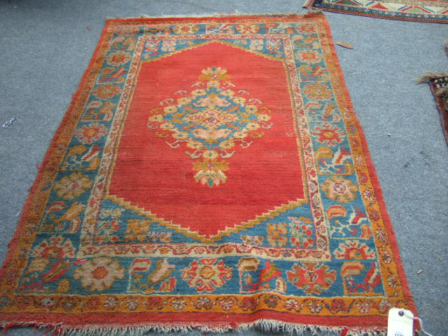 Appraisal: A Turkish rug the plain madder field with a diamond