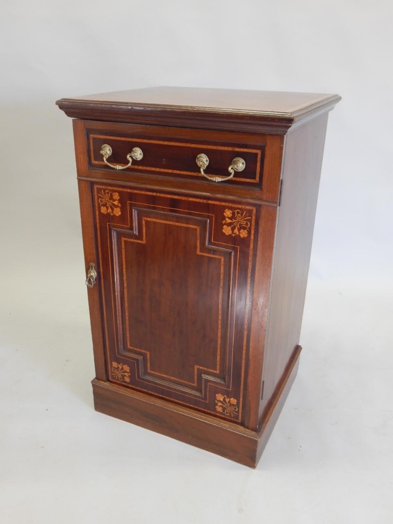 Appraisal: An Edwardian mahogany and marquetry pedestal cabinet the rectangular top