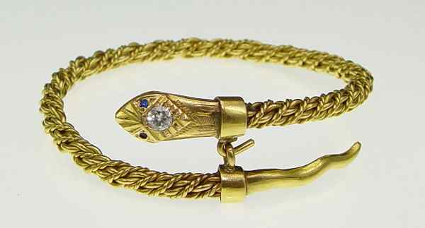 Appraisal: GOLD DIAMOND SNAKE BRACELET k yellow gold snake head bracelet