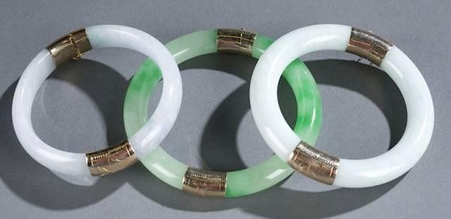 Appraisal: Group of two-peice jade bangles mm and mm A collection